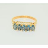 9ct gold on silver blue topaz ring. Size M.