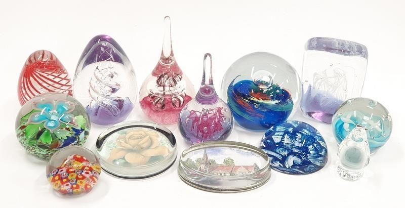 A collection of paperweights to include millefiori Murano castelino.