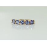 A 9ct gold ladies five stone amethyst ring, size N.