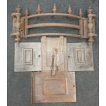 A cast-iron shaped fire grate and fire back panel.