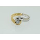 An 18ct gold ladies Diamond Solitaire twist ring, appox 0.25ct, Size J.