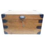 A small vintage school tuck box with key.
