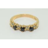 A 9ct gold ladies Diamond and Sapphire 1/2 eternity ring.