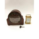 Brass carriage clock together with a Westminster Chiming clock.