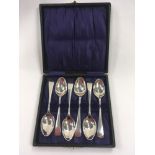 Six cased silver spoons.
