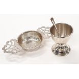 Silver Hallmarked tea strainer together with silver egg cup and spoon.