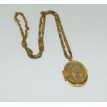 9ct gold locket and chain. 8.8g