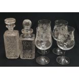 A set of four drinking glasses together with two crystal glass decanters.