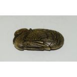 A brass Vesta case in the form of a swan.