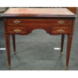 Edwardian Inlaid writing table with tapered legs, porcelain castors and leather top.