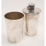 Silver plated drinking flask with a detachable cup.