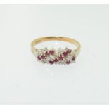 A 9ct gold ruby and diamond ring. Size P.