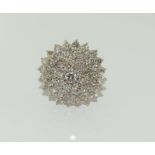 An 18ct white gold and diamond ladies cluster ring, Approx 3ct, Size R.