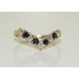 A 9ct gold diamond and sapphire V shaped ring, Size P.