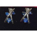A pair of white gold sapphire and diamond earrings.