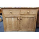 Victorian pine dresser base, two drawers over two cupboards.