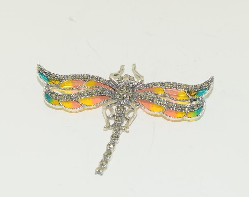 A silver and plique a jour dragonfly brooch.
