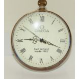 A brass and glass desk ball clock.