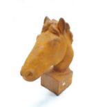 A small cast horse head (159).