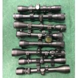 Eight rifle scopes (REF 156).