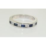 18ct white gold wide sapphire and diamond half eternity band ring. Size R.
