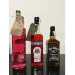 Three bottles of alcohol together with a packet of tobacco (REF 144, 76, 77)