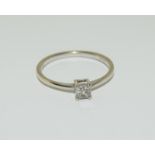 A Diamond princess cut 0.24ct white gold ring with certificate.