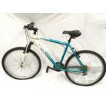 Apollo Twilight green and white mountain bike.