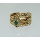 A heavy 10gm 14ct gold snake ring with diamond/emerald Size T.