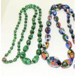 A Large strand of Antique Venetian Millifiori Large Beads with a long strand of green foiled beads.