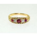 An 18ct Gold ladies Antique set Ruby and Diamond ring, Size Q.