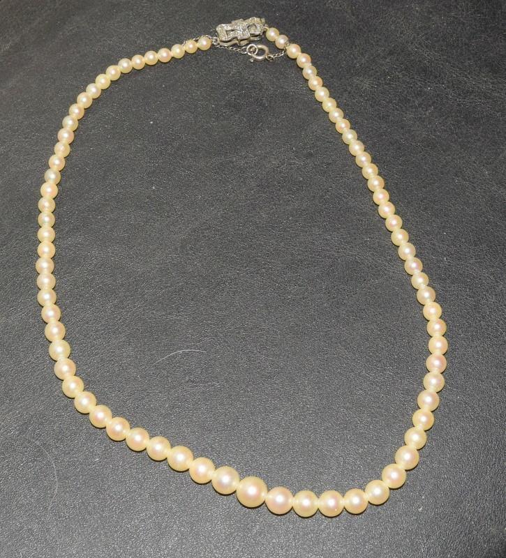 A Strand of Graduated Cultured Sea Oyster Pearls with a Diamond Bow Clasp. - Image 3 of 5