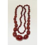 A Strand of Cherry Art Deco Bakelite Amber Beads Marbled with Swirls. 63g