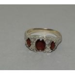 9 carat white gold ladies antique set garnet ring size M