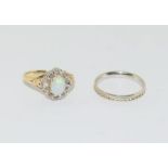 Two ladies 9 carat gold and diamond rings 1 set with opal