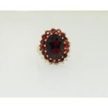 9ct gold ladies large garnet ring. Size Q.