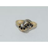 9 carat gold ladies diamond and Sapphire twist ring size S