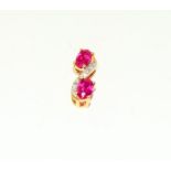 A 14ct gold ruby and diamond set pendant.