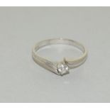 18-carat white gold ladies diamond solitaire twist ring size O. 2.5gms.