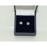 A pair of approx. 1 carat Diamond Solitaire studs in 18ct white gold.