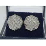 A pair of impressive 14ct white gold diamond earrings of 6.7cts.