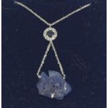 An 18ct white gold carved Sapphire and Diamond fish drop necklace.