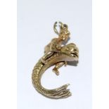 9ct Gold Charm in the shape of a Child Riding a Dolphin. 25mm Tall. 5.8g