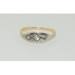 An Antique Art Deco 15ct and Platinum three stone Diamond ring, Size L.