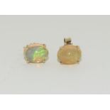 A pair of Firey Opal and 9ct gold stud earrings.