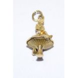 9ct Gold Articulated Elf on Toadstool Charm. 23mm tall. 3.5g