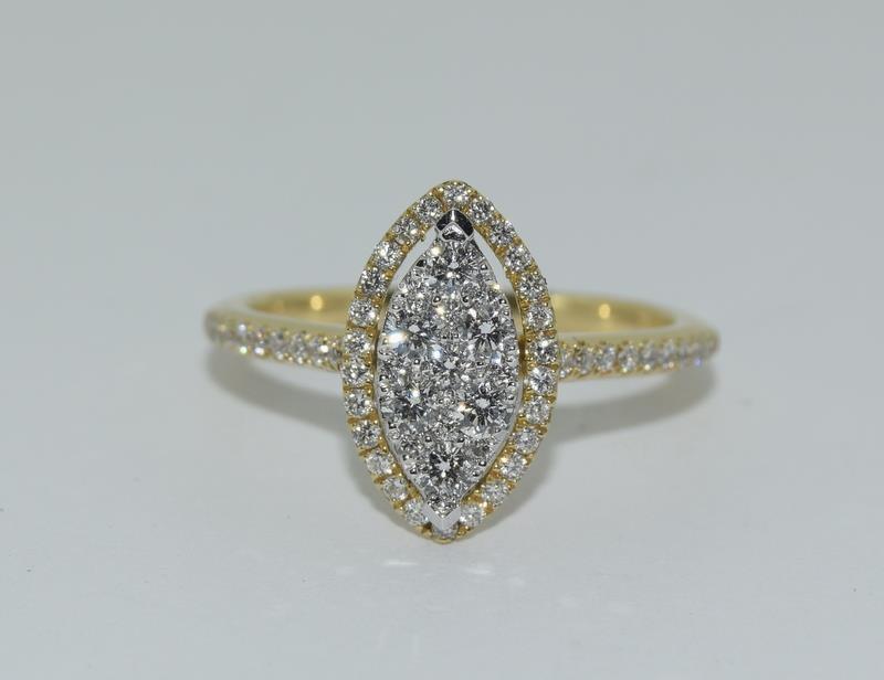 An 18ct yellow gold fine diamond marquise ring of 60 points, Size L