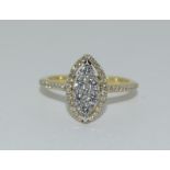 An 18ct yellow gold fine diamond marquise ring of 60 points, Size L