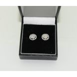A pair of 0.66 carat diamond 18ct white gold Halo stud Earrings.
