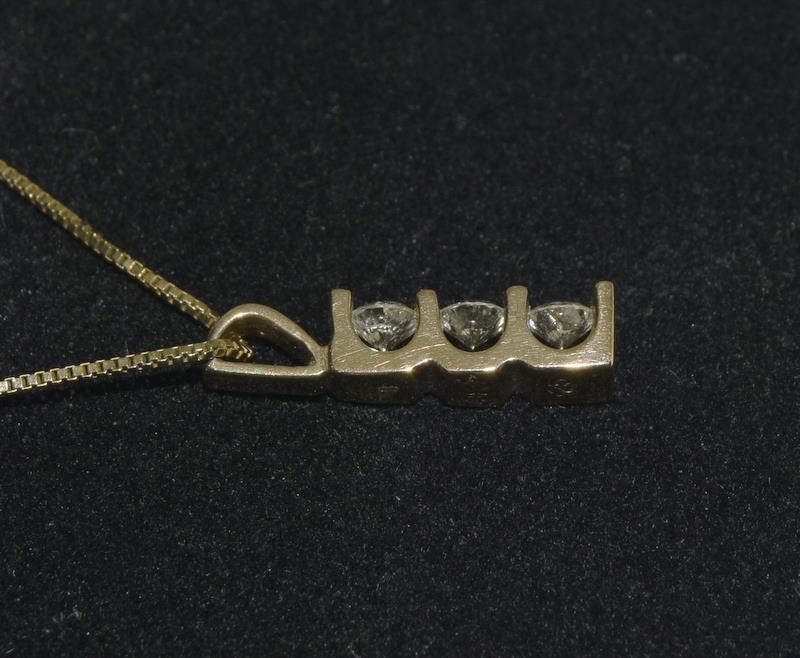 Diamond 3 stone drop pendant 0.25 ct on 9ct Gold chain. - Image 2 of 4